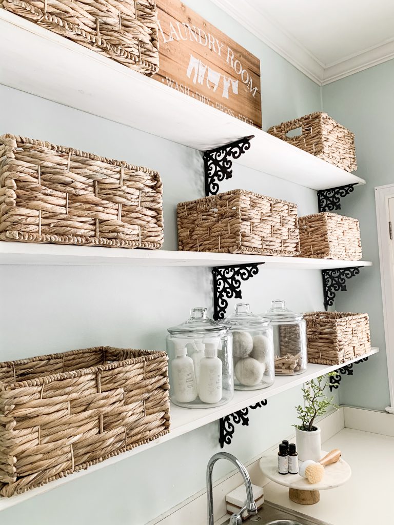 laundry room shelves with baskets and jars for organization
