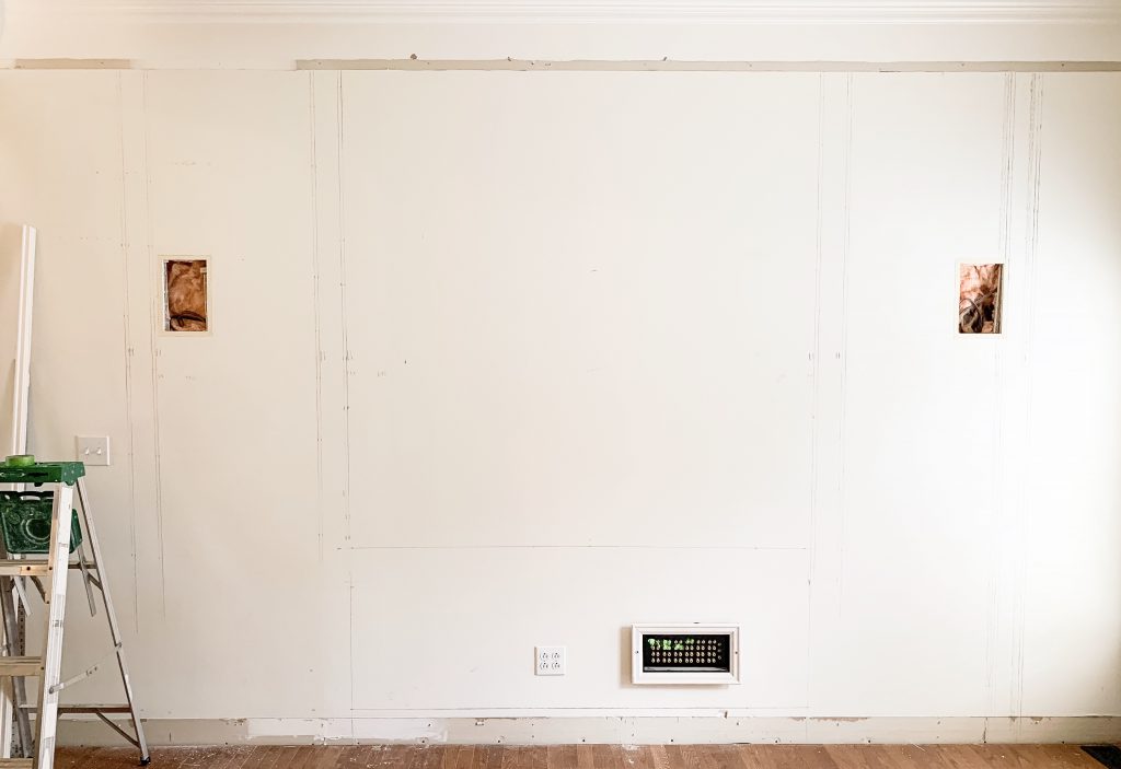 wall with measurements for media cabinet drawn on the wall