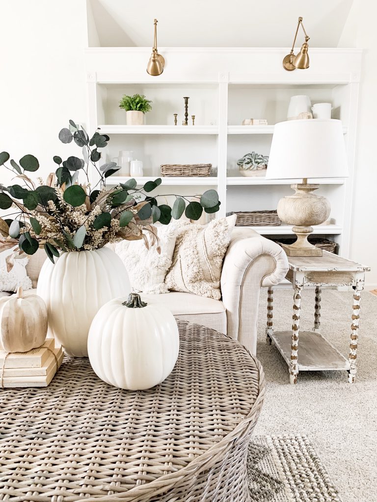 3 white pumpkins on coffee table