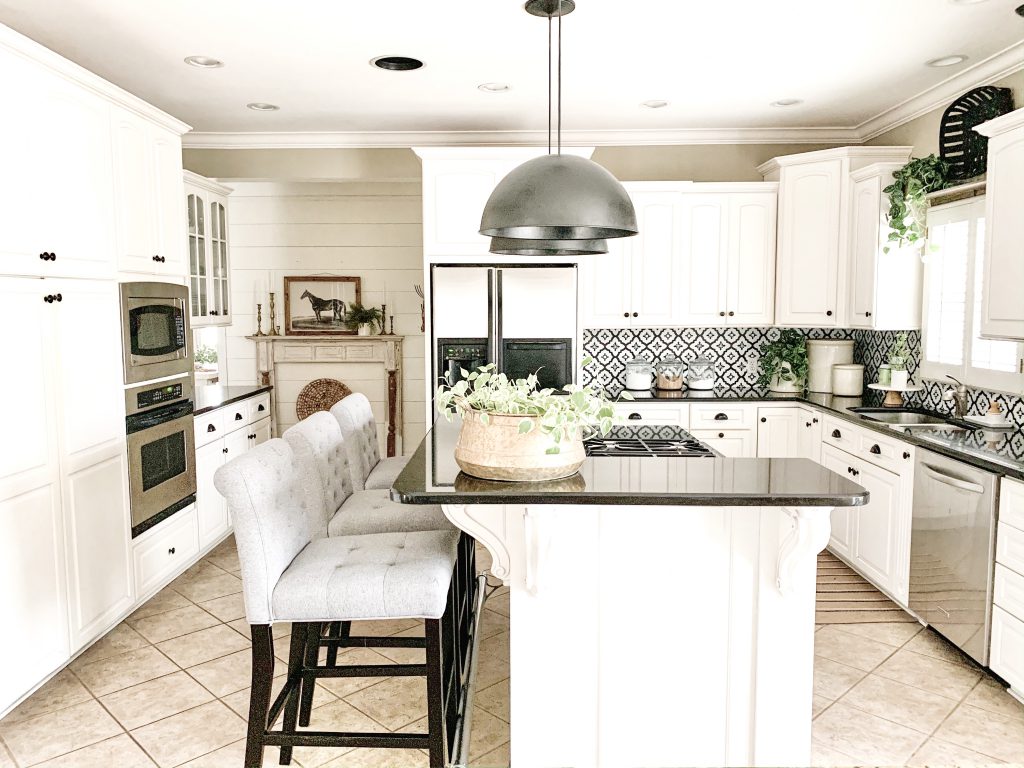 view of kitchen and black and white backsplash