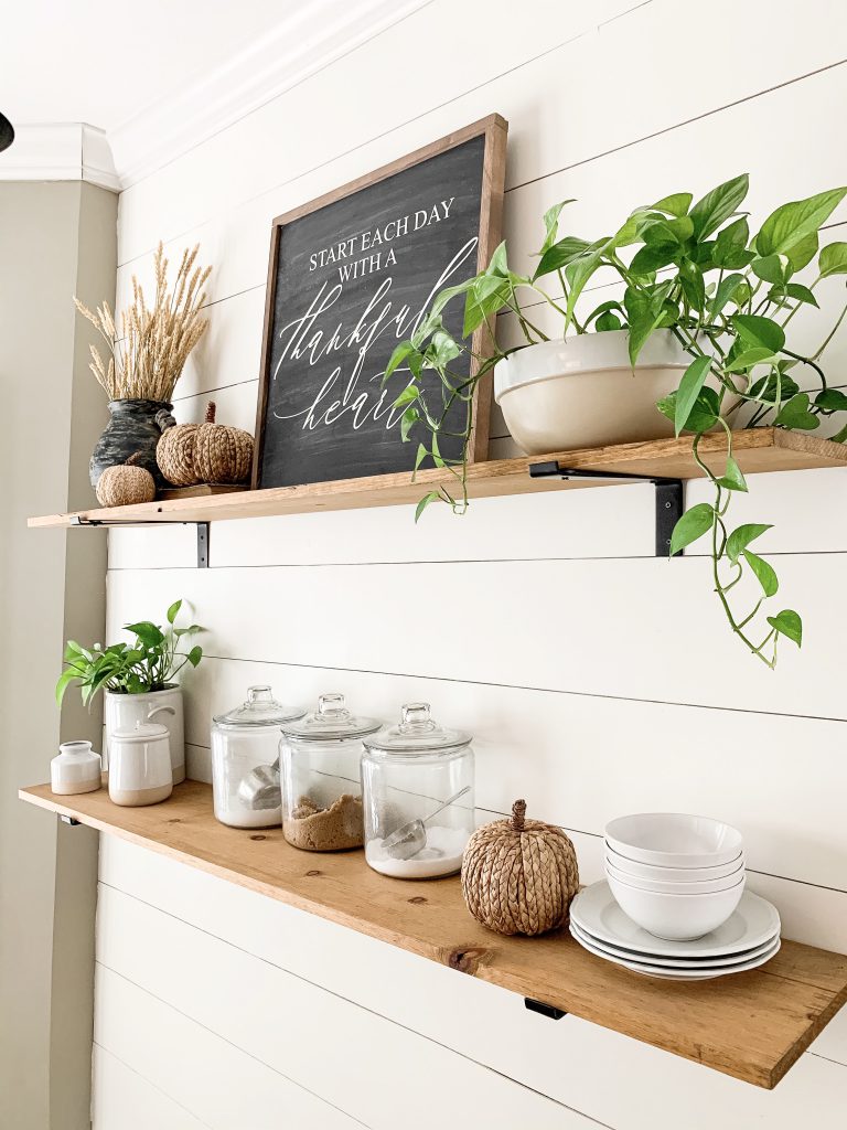 wood shelves in the kitchen with fall decor