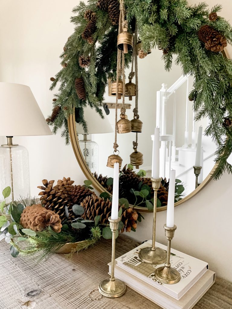 greenery and gold accessories on entryway table 