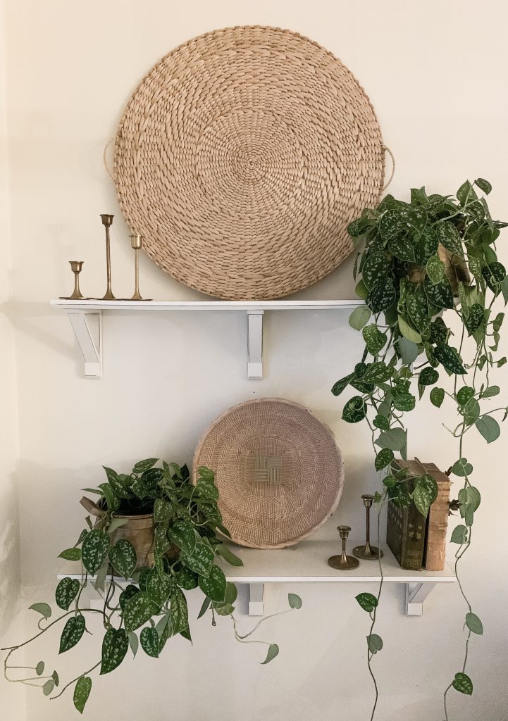 large basket and small basket on white shelves